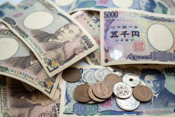 Japanese yen notes and Japanese yen coins for money concept background
