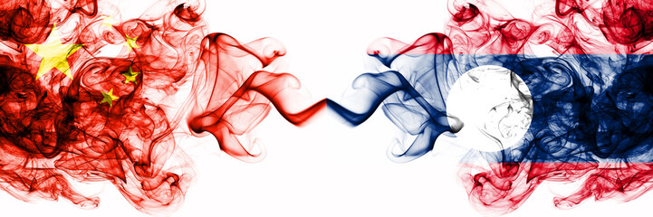China, Chinese vs Laos smoky mystic states flags placed side by side. Concept and idea thick colored silky abstract smoke flags