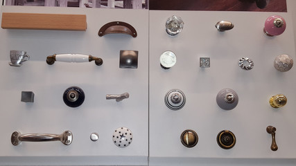 showcase of many closet door handles designed doorknobs on wooden board for sale in shop