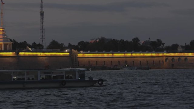 Saint Petersburg. Holiday Scarlet Sails. Russia. Sailboat sailing on the Neva River. Rasvet the sun on the background of the Peter and Paul Fortress. Holidays in the Russian Federation