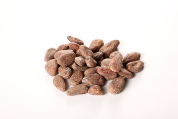 raw cocoa beans isolated on white background with copy space for your text