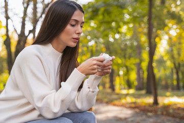 Concentrated female person being deep in her thoughts