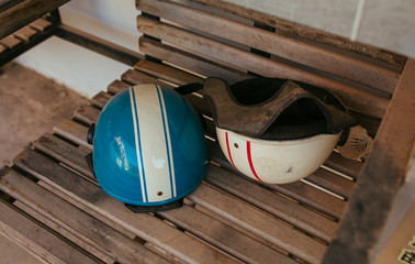 Bike Helmets on wooden bench in Asia