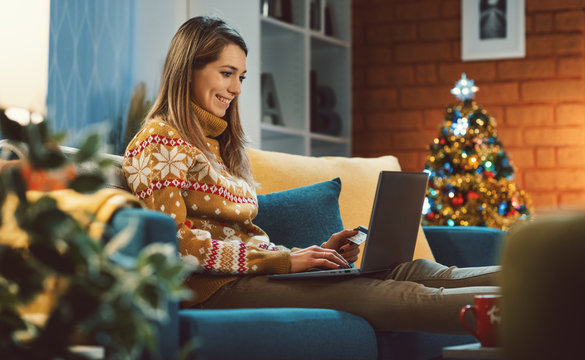 Happy Woman Doing Online Shopping At Christmas