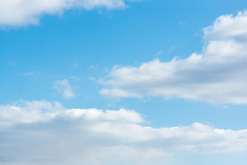 Naklejka premium blue sky with light white clouds