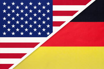 USA vs Germany national flag from textile. Relationship between american and european countries.