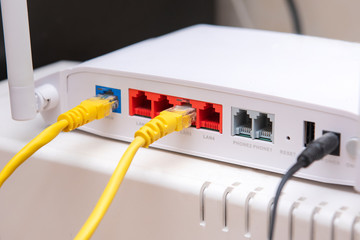white router includes two yellow cable connectors rg45, home route