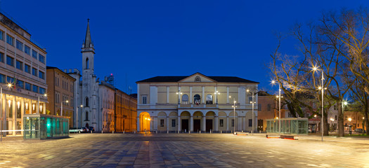 Fototapeta na wymiar Reggio Emilia - Piazza della Vittoria, Teather Ariosto and Galleria Parmeggiani at dusk.