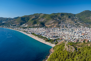 Naklejka premium Alanya, Turkey. Beautiful view from the fortress Alanya Castle of the Mediterranean Sea and Cleopatra beach at suny day. Vacation postcard background
