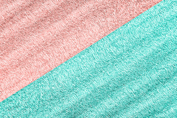 Background of two colors mint and pink with shiny crumpled surface for texture background.