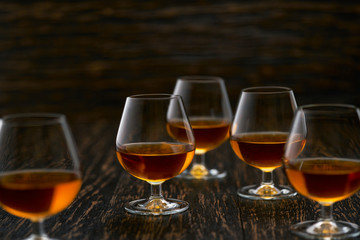 glasses of  congac on a black background, selective focus.