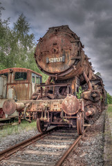 dilapidated, rusty and abandoned steam locomotive