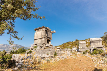 Ancient ruins with burial sarcophagi in Lycian city of Sidyma in Mugla province, Turkey.