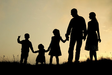 silhouette of a happy family with children