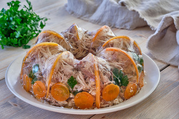 Fototapeta na wymiar National Russian dish Holodec, jelly with parsley