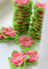 Needlework. Beautiful knitted flowers. Crochet. Roses. Pink flowers.