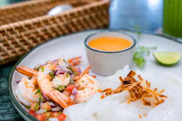 creating Thai fusion menu dish salsa shrimps serve with spicy Tomyum cream 