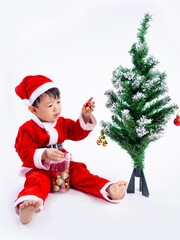 Asian boy is wearing a Santa costume to celebrate Christmas. White background