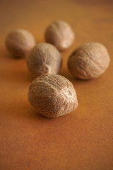 Whole and ground nutmeg a fragrant spice from the fruit of tree Myristica fragrans