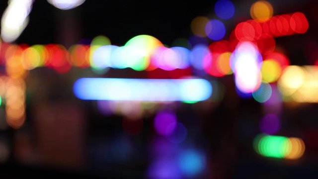 Colorful blinking defocused carnival lights at night