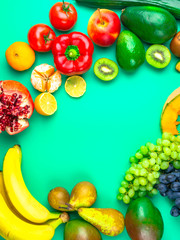 Fruits and vegetables rich in antioxidants, vitamin and fiber on blue background. Flat lay style, selective focus