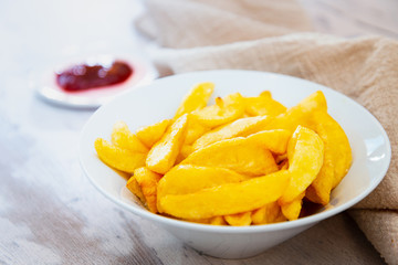 Golden French fries potatoes ready to be eaten