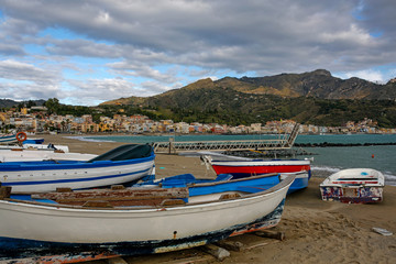Fototapeta na wymiar fishing boats in Giardini-Naxos touristic resort on Sicili, Italy