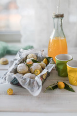 Lemon cookie in a metal box on a white wooden table