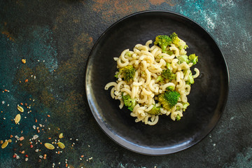 pasta broccoli, vegetarian dish (main course with vegetables Cavatappi, Elbow) menu concept. food background. top view. copy space