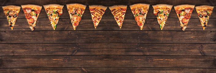 slices of tasty pepperoni pizza looking like christmas flags, creative holiday banner and concept of fast food on wooden background with copy space, top view - obrazy, fototapety, plakaty