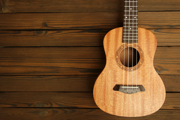 Ukulele  on wooden background