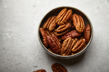 Delicious pekan nut on a bright background