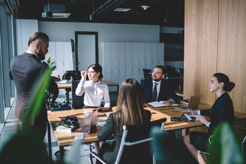 Executives listening to male colleague