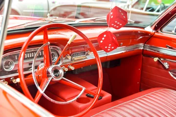 Deurstickers red interior dashboard of red vintage car © Chopard Photography