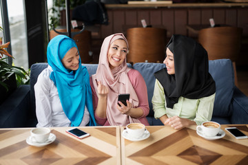 Young muslim woman in the restaurant