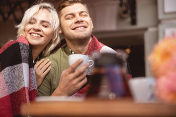 Couple celebrating their anniversary in a cozy cafe