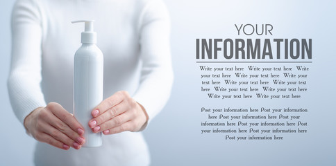 Woman holding bottle with dispenser lotion cream beauty on gray light background, space for text