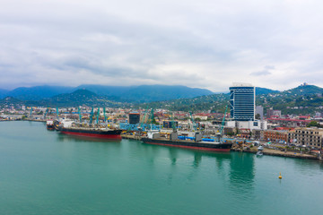 Fototapeta na wymiar Bulk cargo ship under port crane, Batumi seaport, Georgia