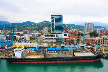 Bulk cargo ship under port crane, Batumi seaport, Georgia
