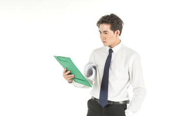 Portrait of smart young asian businessman with white shirt and blue tie lookting and holding green paper clipboard and work report roll of  on isolated white background and copy space.