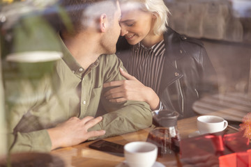 Couple meeting in the cafe after a long break