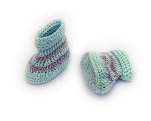 Fototapeta na wymiar knitted baby booties on white