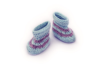 knitted baby booties on white