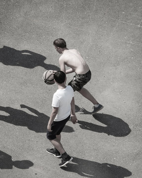 Guys Play Streetball On Yard