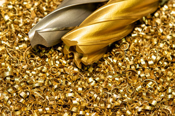 Drills cutters for processing hard metals, against the background of industrial waste. © Виктор Гончарук