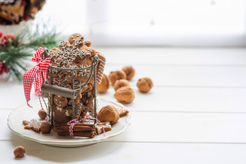 Christmas decorations with light behind it, creating a nice blurry boken. Christmas or new year still life with ornaments on rustic white table. Copy space for text.