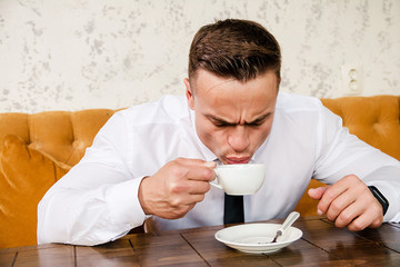 Businessman drinking a cup of coffee