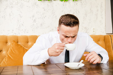 Businessman drinking a cup of coffee