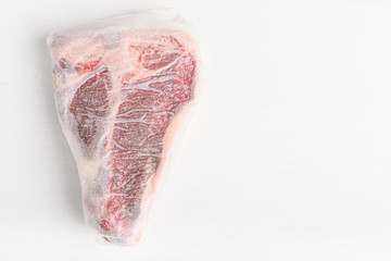 a piece of fresh farm meat t-bon non-GMO wrapped in eco-friendly wrapping paper