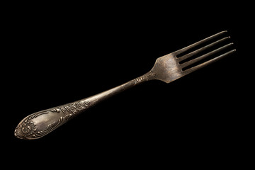 vintage fork on a black background - Powered by Adobe